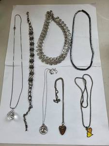 lot 63R image: Set of 8 Assorted Costume Jewelry Necklaces with Charms and Chains