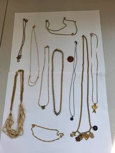 lot 84R image: Collection of 10 Gold Tone Costume Jewelry Necklaces with Charms