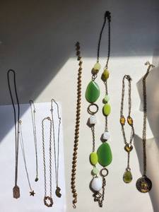 lot 143R image: Collection of 4 Costume Jewelry Necklaces with Charms and Beads
