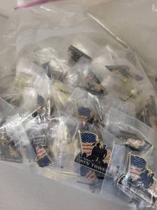 lot 31S image: Large Lot of Patriotic American Flag Lapel Pins and Twin Towers Memorial Pins