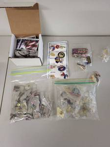 lot 32S image: Collection of Patriotic Lapel Pins and God Bless America Stickers