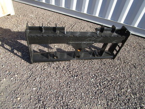 lot 46 image: Wolverine Skid Steer Pallet Fork Bracket wBale Spear & Receiver Hitch Mounts