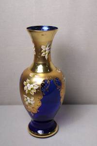 lot 16 image: Hand-Painted Blue and Gold Glass Vase with Floral Design