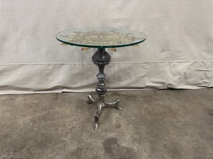 lot 40 image: Glass Top Accent Table with Ornate Brass Medallion and Metal Base