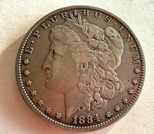 lot 17R image: 1884 Morgan Silver Dollar Coin in Very Good Condition