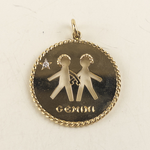 lot 1A image: Cartier 14kt Gold Gemini Zodiac Pendant with Diamond Accent