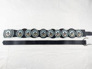 lot 1B image: Betty & Ernest Shirley Navajo Sterling Silver Concho Belt with Devil Dancer Inlay and Sleeping Beauty Turquoise. Original Retail $15,000