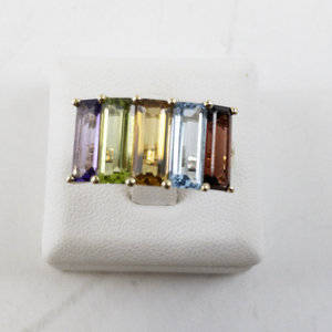 lot 7 image: 14K Yellow Gold Ring with 5 Emerald Cut Gemstones. Size 7
