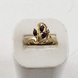 lot 84 image: Size 6.75 Base Metal Ring with Purple Stones and Leaf Design