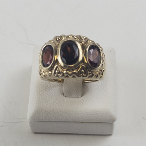 lot 86 image: Size 7.25 Base Metal Ring with Lab Grown Ruby Stones