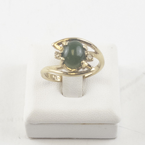 lot 97 image: Size 7 Base Metal Ring with Green Stone and Rhinestones