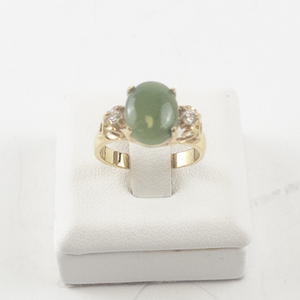 lot 98 image: Size 5 Gold Tone Ring with Green Stone and CZ Accents