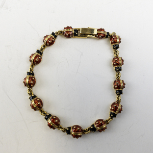lot 162 image: 7.5in Gold Tone Base Metal Ladybug Link Bracelet
