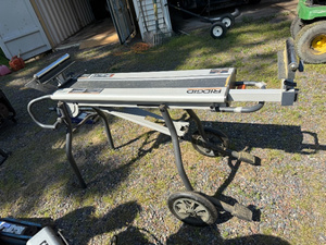 lot 18 image: RIDGID Portable Miter Saw Stand with Wheels