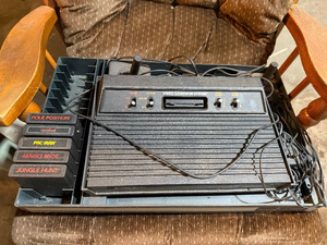 lot 132 image: Atari 2600 Console with 5 Classic Games - Pac-Man, Mario Bros & More