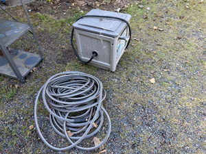 lot 150 image: Garden Hose Storage Box with Reel and Additional Hose