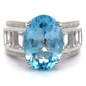 lot 24 image: 9.12 Carat Oval Blue Topaz & White Topaz Channel Ring VIDEO
