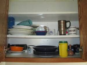 lot 52 image: Cupboard filled with dishes and kit...