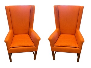 lot 37 image: Pair of Coral Upholstered Wingback Armchairs with Wooden Legs