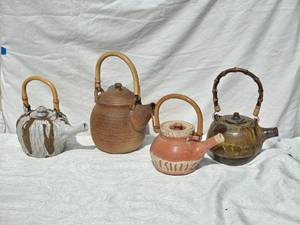 lot 170 image: Charming Earthenware Teapot Group with Bamboo Handles