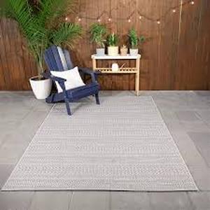 lot 33 image: Hampton Bay Natural Ash Grey 8 ft. x 10 ft. Striped IndoorOutdoor Patio Area Rug  Customer Returns See Pictures
