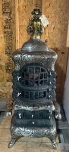 lot 79 image: Antique Cast Iron Parlor Stove with Topper Nickle Plated  Sparkling Universal  No 135