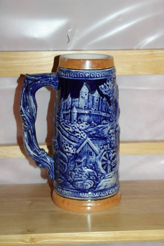 lot 194 image: Blue German-Style Beer Stein with Relief Design and Las Vegas Motif