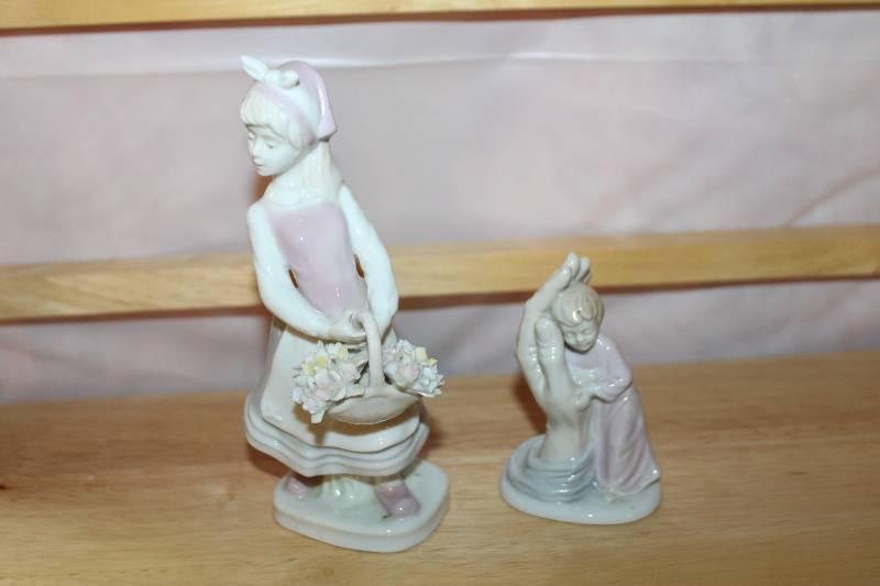 lot 215 image: Set of 2 Porcelain Figurines Girl with Flower Basket and Child in Prayer