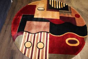 lot 427 image: Signature Collection Jewel Tone Multishapes 56 Round Wool Rug
