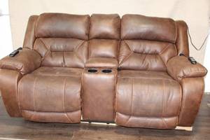 lot 435 image: Dual Power Reclining Loveseat with Center Console and Cup Holders