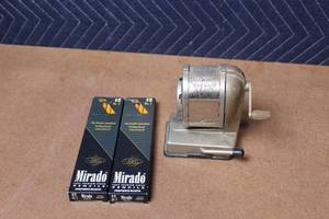 lot 404 image: Boston Vacuum Mount Pencil Sharpener with 2 Boxes of Mirado No. 2 Pencils