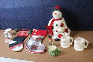 lot 409 image: Holiday Decor Collection with Stockings, Snowman, Santa Mugs, and Figurines