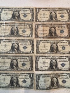 lot 142 image: $1 Dollar Blue Seal Silver Certificates