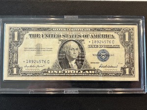 lot 144 image: 1957 Blue Seal $1 Dollar Silver Certificate Star Note Uncirculated