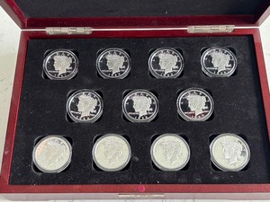 lot 173 image: Silver Plated Peace Dollar Replica Set