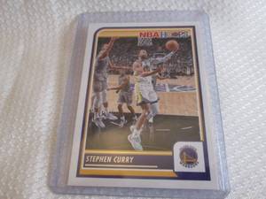 lot 15 image: 2023-24 Hoops Stephen Curry Card...
