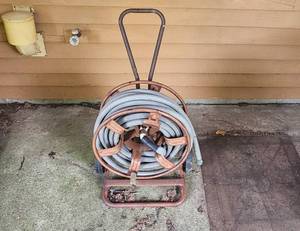 lot 87 image: Metal Hose Reel Cart with Garden Hose
