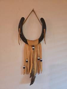 lot 93 image: Horseshoe Wall Hanging with Leather Fringe and Bead Accents