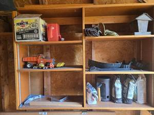 lot 323 image: Garage Shelf Lot with Vintage Toy Trucks, Birdhouse, Rope, and Various Tools
