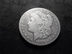 lot 25 image: 1884 CC Morgan Silver Dollar