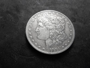 lot 26 image: 1884 O Morgan Silver Dollar