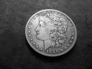 lot 33 image: 1886 O Morgan Silver Dollar