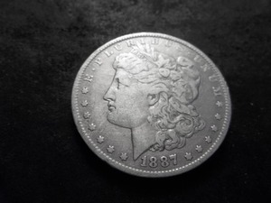 lot 36 image: 1887 O Morgan Silver Dollar