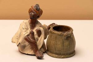 lot 77 image: Sitting Native Metal Match Holder