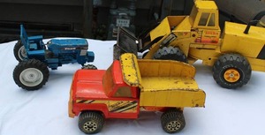 lot 17 image: 3 Mid Century Metal Truck Toys 2 Tonka Trucks and Ford Tractor