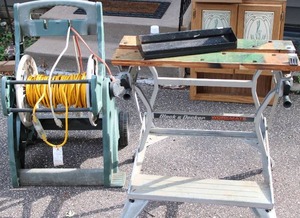 lot 50 image: Black & Decker workbench with tool Tray and Long Electrical extension cord on hose reel
