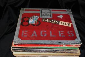 lot 128 image: Vintage Vinyl Album Collection  Eagles, Rolling Stones, Moody Blues, Monkees & More  History of Rock & Roll Book  30  LPs
