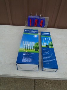 lot 104 image: New 10 in total solar garden lights. As shown.