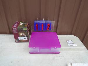 lot 112 image: Outdoor LED pond light & organizers. As shown.