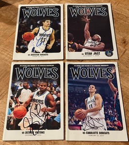 lot 100 image: (4) Signed Minnesota Timberwolves Basketball Programs - Sebastian Telfair, Luke Ridnour, Sasha Pavlovic, Martell Webster